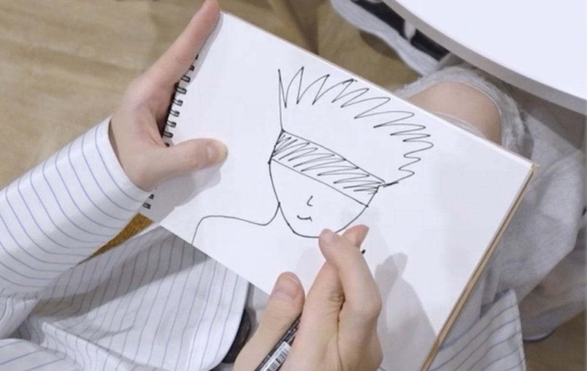 bobalix_'s tweet photo. Felix drawing gojo using his own hand ref 🤞🏻 https://t.co/v6WJF5JoTq