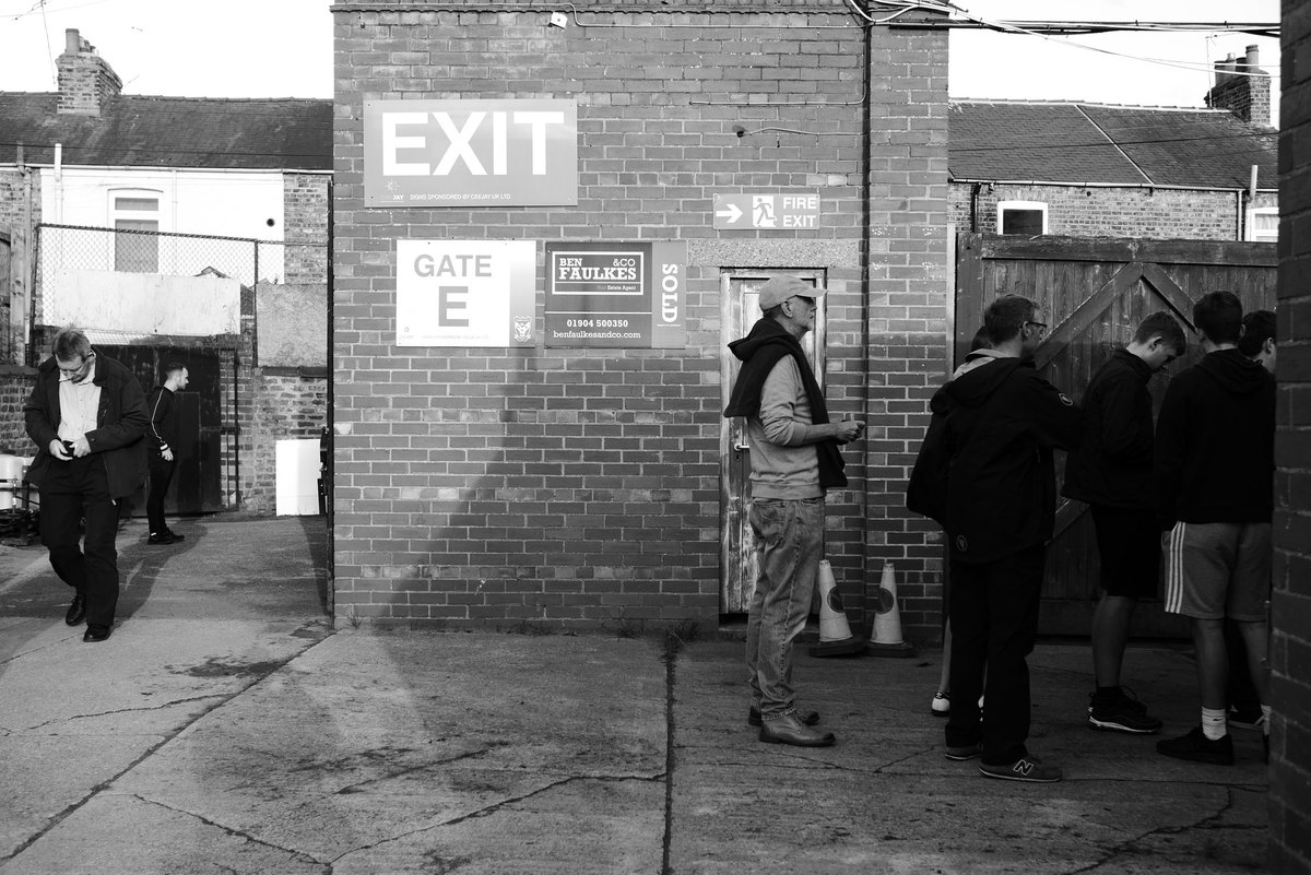 Yorktone's tweet photo. Remembering Bootham Crescent 

The tinny, echoing PA warbles above the chatter of friendly greetings and conversations...

"I guess I'll never know the reason why
You love me as you do
That's the wonder
The wonder of you..."

#ycfc #football #photography #nonleague #efl https://t.co/8Mmf26NmDV
