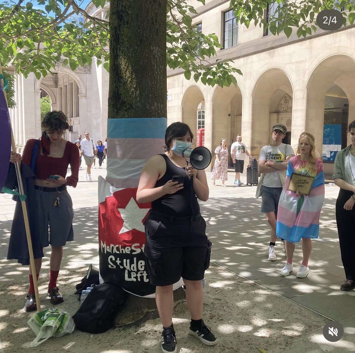 _ConnieShaw's tweet photo. Green Party Hannah Spencer MP, draped in a trans flag and holding a sign that says ‘trans liberation now’, joins students in Manchester to protest against the EHRC guidance that protests women only spaces. https://t.co/SMEK9BMYMp