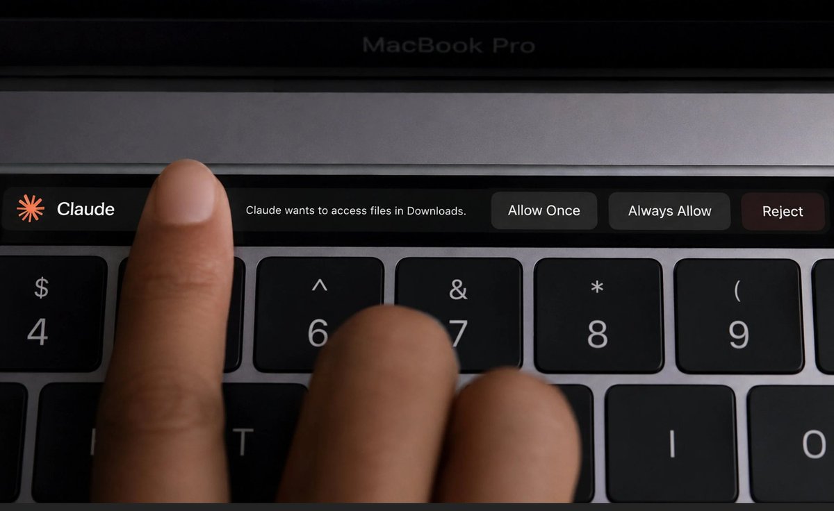 jbuilderx's tweet photo. Claude accidentally proving the Touch Bar deserved better https://t.co/9fXh9itBy9