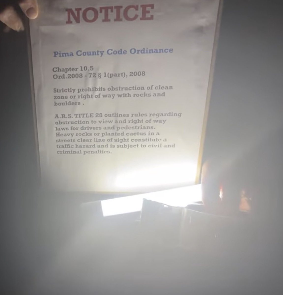 imadriienne's tweet photo. #NancyGuthrie #BringNancyHome #FindNancyGuthrie           

NEW SIGN!🚫

This new sign has been placed outside Nancy Guthries neighbourhood; 

________________________ 

“NOTICE 

Pima County Code Ordinance

Chapter 10.5
Ord.2008-72 § 1(part), 2008

Strictly prohibits obstruction of clean zone or right of way with rocks and boulders.

A.R.S. TITLE 28 outlines rules regarding obstruction to view and right of way laws for drivers and pedestrians.

Heavy rocks or planted cactus in a streets clear line of sight constitute a traffic hazard and is subject to civil and criminal penalties.

________________________ 

👇🏼👇🏼👇🏼👇🏼👇🏼