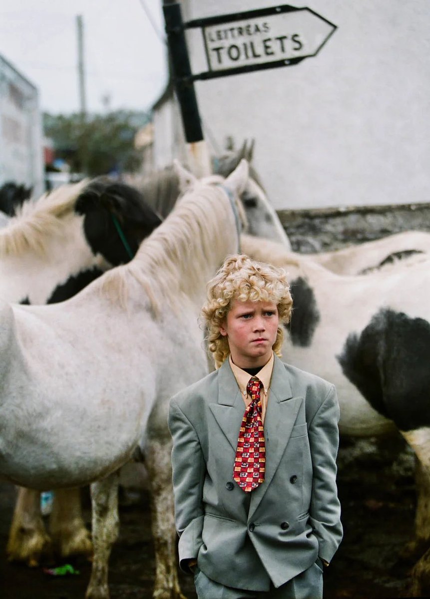 eyeonaxis's tweet photo. A boy of the Traveller community wears his Sunday suit at Tallow horse fair, Co Cork, Ireland, 2000, by Kenneth O'Halloran https://t.co/8da8xPtEd2
