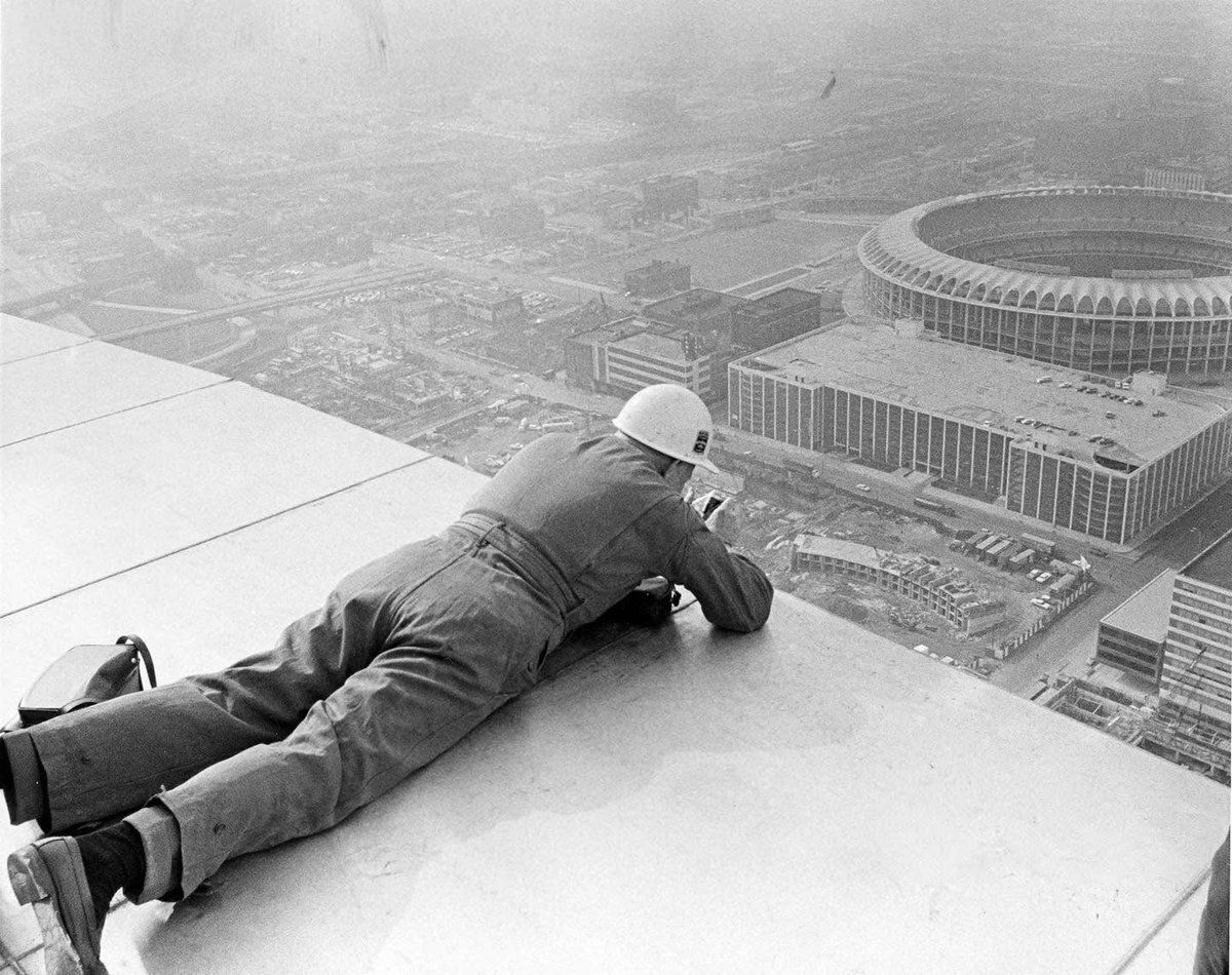 baseballinpix's tweet photo. Construction worker on top of the Arch overlooking Busch Stadium, 1965 https://t.co/pNd3OXBCrp