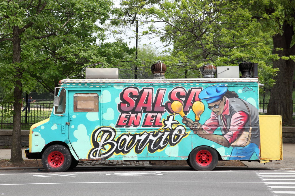 EIT's tweet photo. Seen in passing: Salsa en El Barrio, hand-painted artwork on the most colorful of four chimichurri and frituras trucks parked alongside Highbridge Park, in Washington Heights https://t.co/qxTSRIyyaB