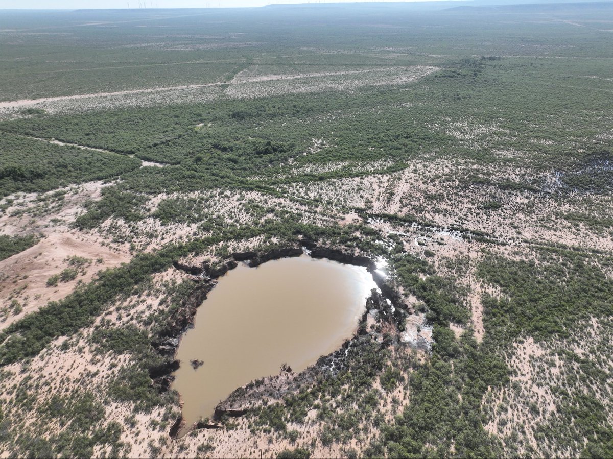zombiewellz's tweet photo. Latest drone shots from McCamey sinkhole where last week’s rain caused the oil to overflow and spill onto University Lands. Why hasn’t the RRC admitted this is a problem yet? I’m sure Bo French has a plan, right? https://t.co/hzFRK48ZoY