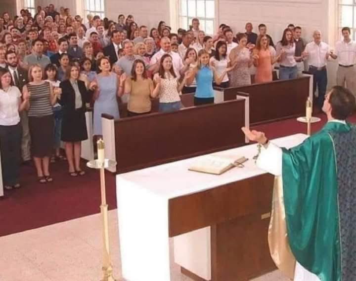 realCarola2Hope's tweet photo. Pope Leo XIV recently spoke about abuses of the liturgy. 

The image shows one of the most common examples: the misuse of the orans posture (hands raised and extended) by the faithful during the Our Father.

In nearly every Novus Ordo Mass I attend (98% of them), the congregation does this.

This posture is proper to the priest, who stands in persona Christi, in the person of Christ, during the Our Father. 

He extends his hands to God on behalf of the people, acting as their mediator and leader in prayer.

The laity have their own proper role: to pray with the priest, not to imitate his gestures. 

The orans posture is a priestly gesture, not one intended for the non-ordained faithful.

Non-Catholics often pray this way because they do not have (or do not believe they need) a Catholic priest to lead them in prayer. 

In the Catholic Mass, however, it is a grave abuse for members of the non-ordained faithful to “quasi-preside” in this manner, blurring the distinct roles of priest and people.