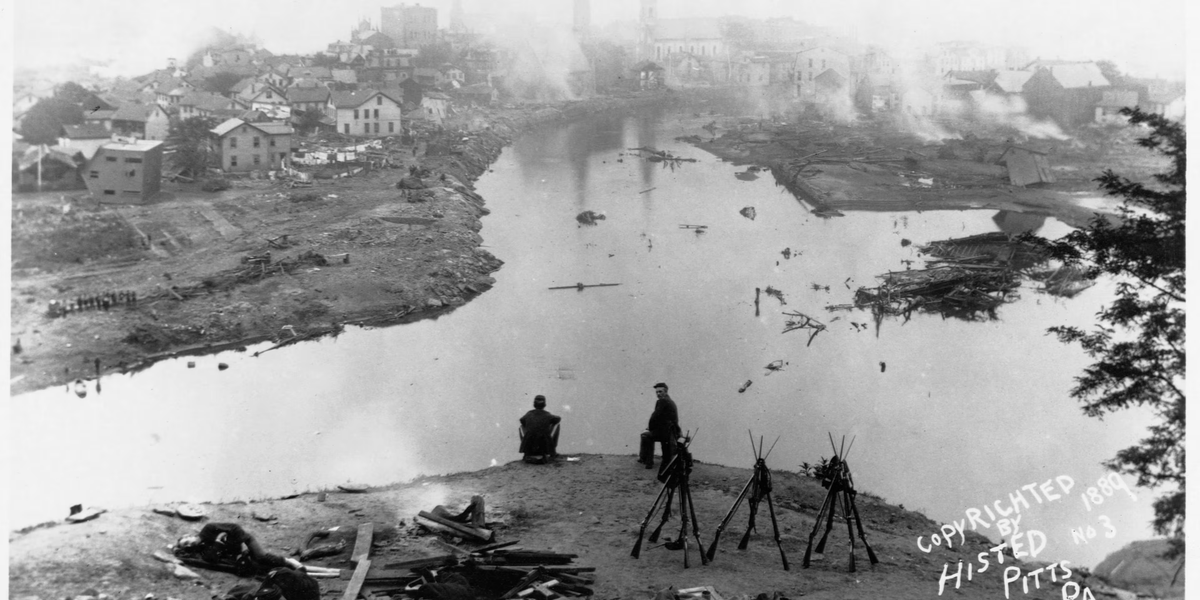 EchoesofWarYT's tweet photo. 137 years ago today, the richest men in America accidentally drowned a town and never paid for it.

May 31, 1889. It had rained for days. Fourteen miles above Johnstown, Pennsylvania sat Lake Conemaugh, a private mountain reservoir held back by an aging earthen dam. The dam belonged to an exclusive retreat called the South Fork Fishing and Hunting Club. The members? Andrew Carnegie. Henry Clay Frick. Andrew Mellon. The titans of the Gilded Age.

To make their getaway nicer, the club had lowered the top of the dam to widen a carriage road, and screened the spillway with iron grates so their stocked fish could not swim away. Those grates clogged with debris. The one thing that could relieve the pressure was now blocked.

At 3:10pm the dam let go.

Twenty million tons of water, an entire lake, came down the narrow valley at 40 miles an hour. For a few minutes the flow equaled the Mississippi River. Witnesses did not describe a wave. They described a rolling brown wall, three to four stories high, grinding houses, trees, locomotives, and people into a single moving mass of wreckage. Some survivors rode their own floating rooftops for miles.

Then came the part most people never hear.

The debris piled up against a massive stone railroad bridge at the edge of town. Thirty acres of shattered homes and trapped human beings, stacked seventy feet high. And then it caught fire. People who had survived the water, pinned alive in the wreckage, burned to death within sight of rescuers who could not reach them. The pyre burned for three days.

When it was over: 2,209 dead. 99 entire families erased. 396 children. 777 victims so destroyed they were never identified, buried beneath a single monument to the unknown.

Clara Barton arrived on June 5 with the young American Red Cross. It was their first major disaster relief operation, and it made the organization a household name.

The survivors sued the club. They lost. The courts ruled the disaster an "act of God." Not one member was ever held legally liable. Carnegie built the town a library. Frick and Mellon went on to become two of the wealthiest men in human history.

A lake full of leisure for a few. A mass grave for thousands. And a courtroom that called it the will of heaven.