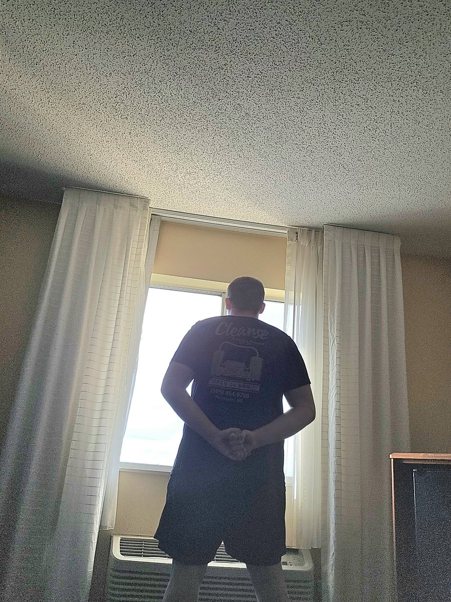 FindingAureus's tweet photo. Looking out the window of my third story hotel room like an evil villain https://t.co/6I6W1TVwyA
