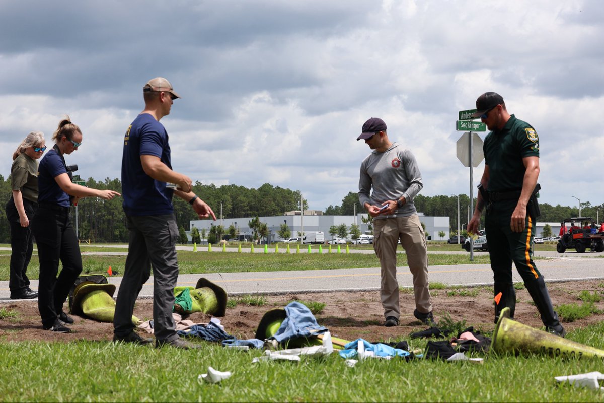 TeamSJSO's tweet photo. SJSO Forensics and Traffic Units partnered with @FBIJacksonville and National Transportation Safety Board (@NTSB) this week for a joint training exercise. 

The teams worked through a full-scale exercise simulating a mass-casualty incident using scene-mapping technology and evidence collection processes. 

Trainings like this strengthen interagency coordination, preparedness, and investigative skills needed to protect our community. #TeamSJSO