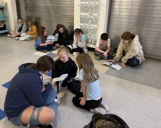 CorinthNY's tweet photo. Our 6th grade ELA students partnered with 1st graders as pen pals to build a love of reading and writing while serving as mentors! They recently visited CES to meet their pen pals and read together.  Great job, Riverhawks! #ReadersasLeaders #RiverhawksRising https://t.co/a0ymqsQOT1