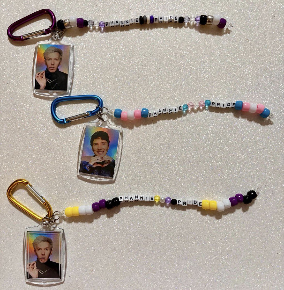 ninaisayapper's tweet photo. I will have new pride keychains (and other keychains and toploaders coming this month!) but I wanted to announce today that 50% of the proceeds from all of my Pride products will go to The Trevor Project 🏳️‍🌈🏳️‍⚧️🩷
https://t.co/5LWlZqHxez https://t.co/soPq1EY2dl