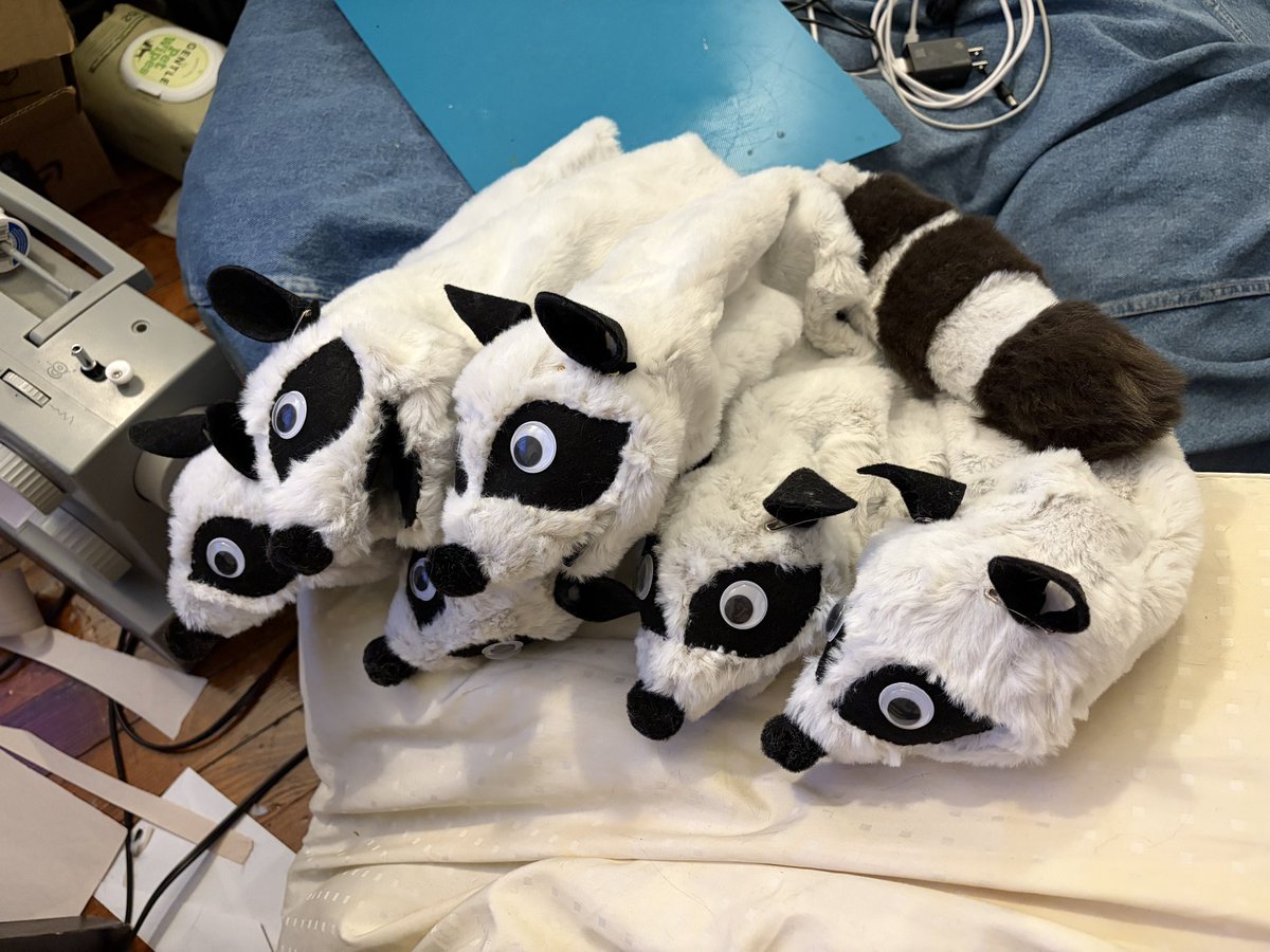 dummydino's tweet photo. sorry for being a bit mia w comms recently. i was making raccoons stacked in trench coats https://t.co/MPzeMaJnnm