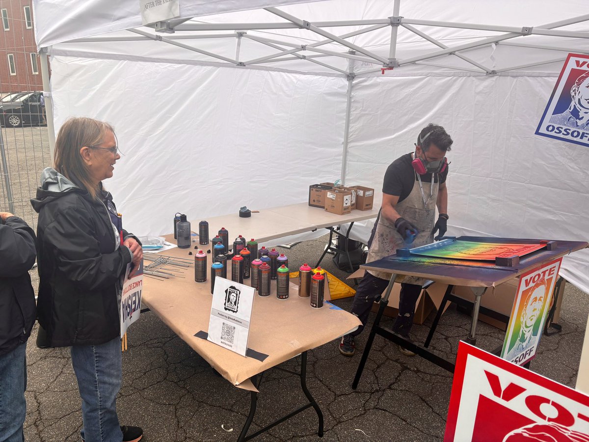 ribunchreports's tweet photo. A cool souvenir: Spray-painted Ossoff posters were available for supporters outside the venue. #gapol https://t.co/x0vdJG8rTu