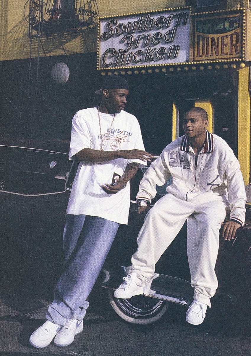 LadePlatinum's tweet photo. Wood Harris and JD Williams (Avon &amp; Bodie from “The Wire”) in front of the famous M&amp;G Diner on 125th Street in Manhattan, New York, 2003. 

Wood Harris is wearing white and blue Nike Air Force 1s. JD is wearing Adidas Shell Toes. https://t.co/CZia06Uvn9