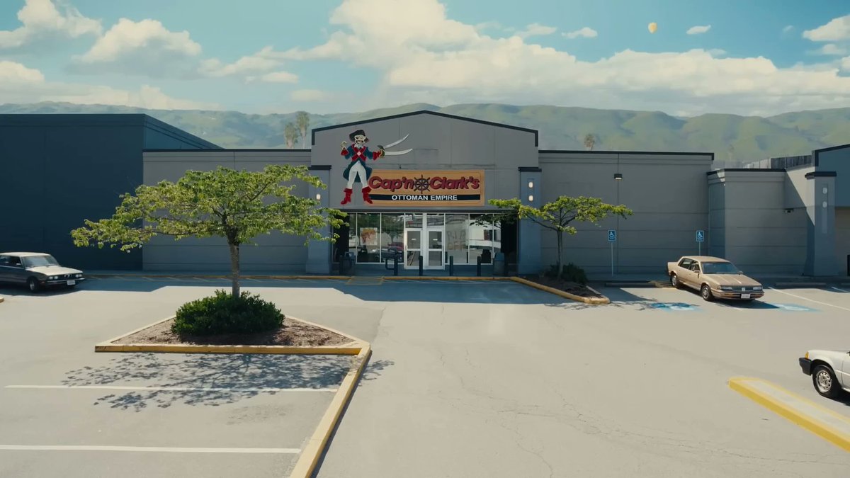Hex_Beee's tweet photo. One thing I adore about Backrooms is how unreal and dreamlike the real world looks. The hills, the clouds, the random balloon, and just the building in general just looks wrong https://t.co/0tGN6xP9yl