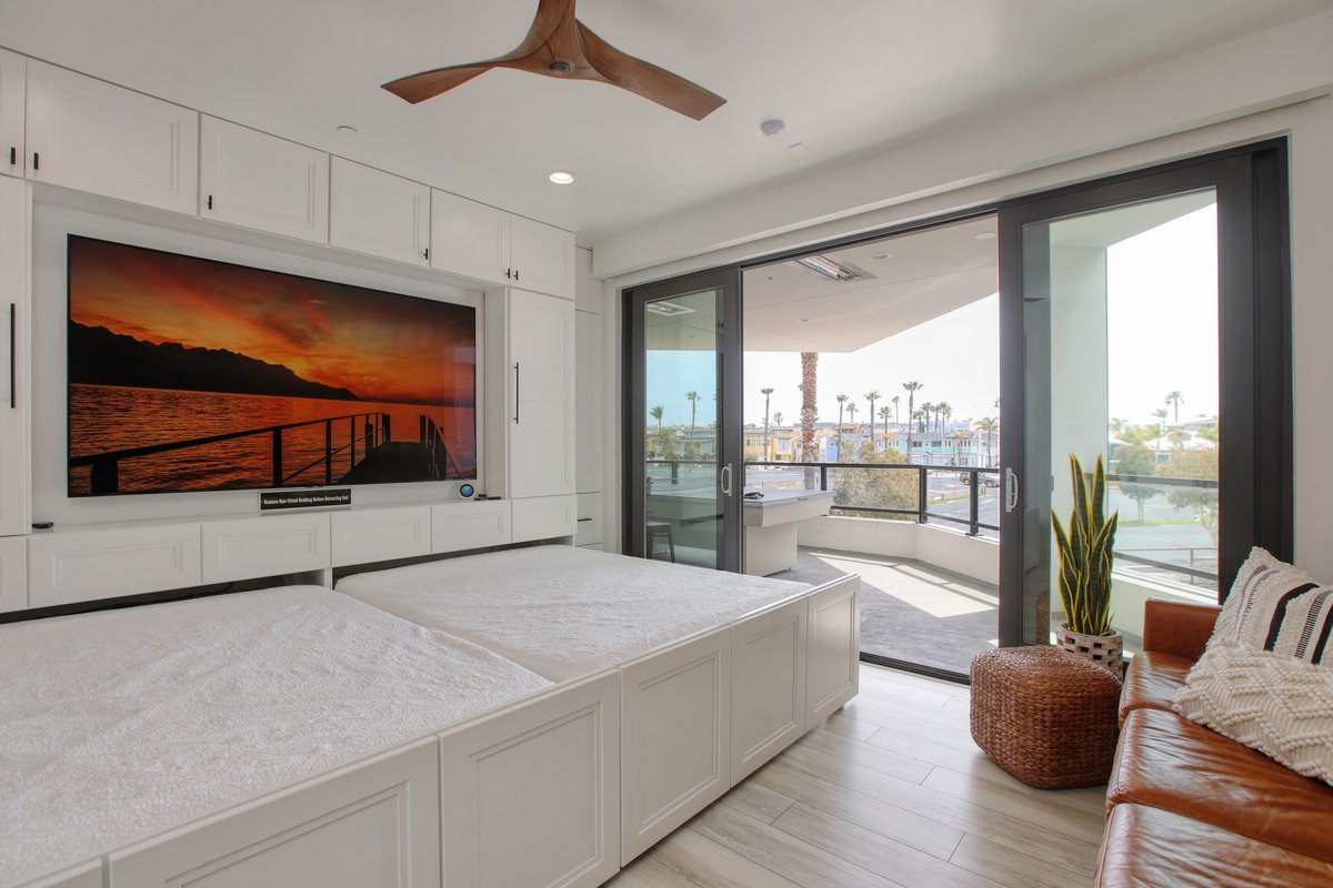 CobbosBH's tweet photo. Game room by day, bedroom by night. Our Cove Room is a den with unique cabinetry where two queen beds roll out from behind the woodwork surrounding the TV with the touch of a button.

#vacation #summertravel #airbnb #visitca https://t.co/tHWXApoC0K