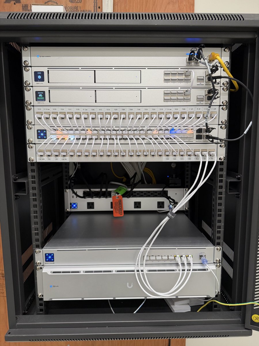 AdiumTech's tweet photo. This rack came together nicely and it swings open for easy access in the back. Just wish it came in silver!

Full console redundancy using the WAN switch and two UDM Pro Max’s in shadow mode. https://t.co/2bs5bA8SZR