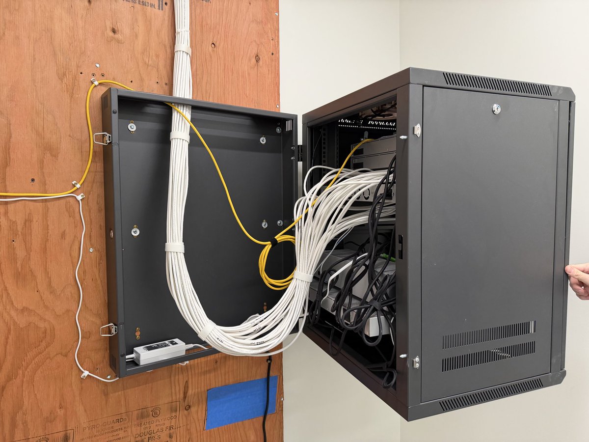 AdiumTech's tweet photo. This rack came together nicely and it swings open for easy access in the back. Just wish it came in silver!

Full console redundancy using the WAN switch and two UDM Pro Max’s in shadow mode. https://t.co/2bs5bA8SZR
