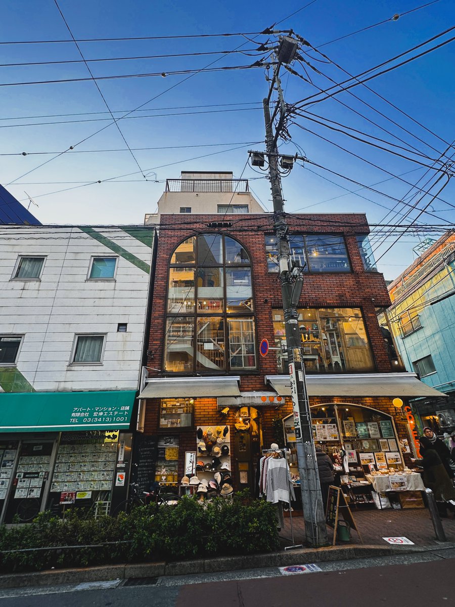 ThomFain's tweet photo. Found myself in a used clothing store in Shimokitazawa this morning looking at a rack of American band tees next to a rack of happi coats. 

Nobody planned this, but that's Tokyo; nobody had to. Just decided to take an escalator to the JR line headed the other way. https://t.co/4Zc4voXdjj