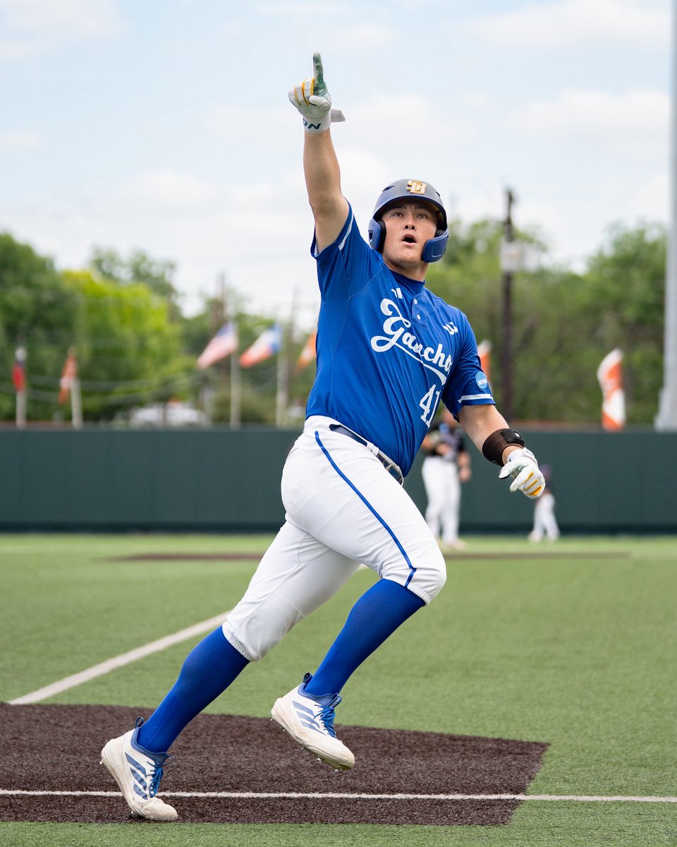Noah Karliner pointing up to the stands after hitting a home run.