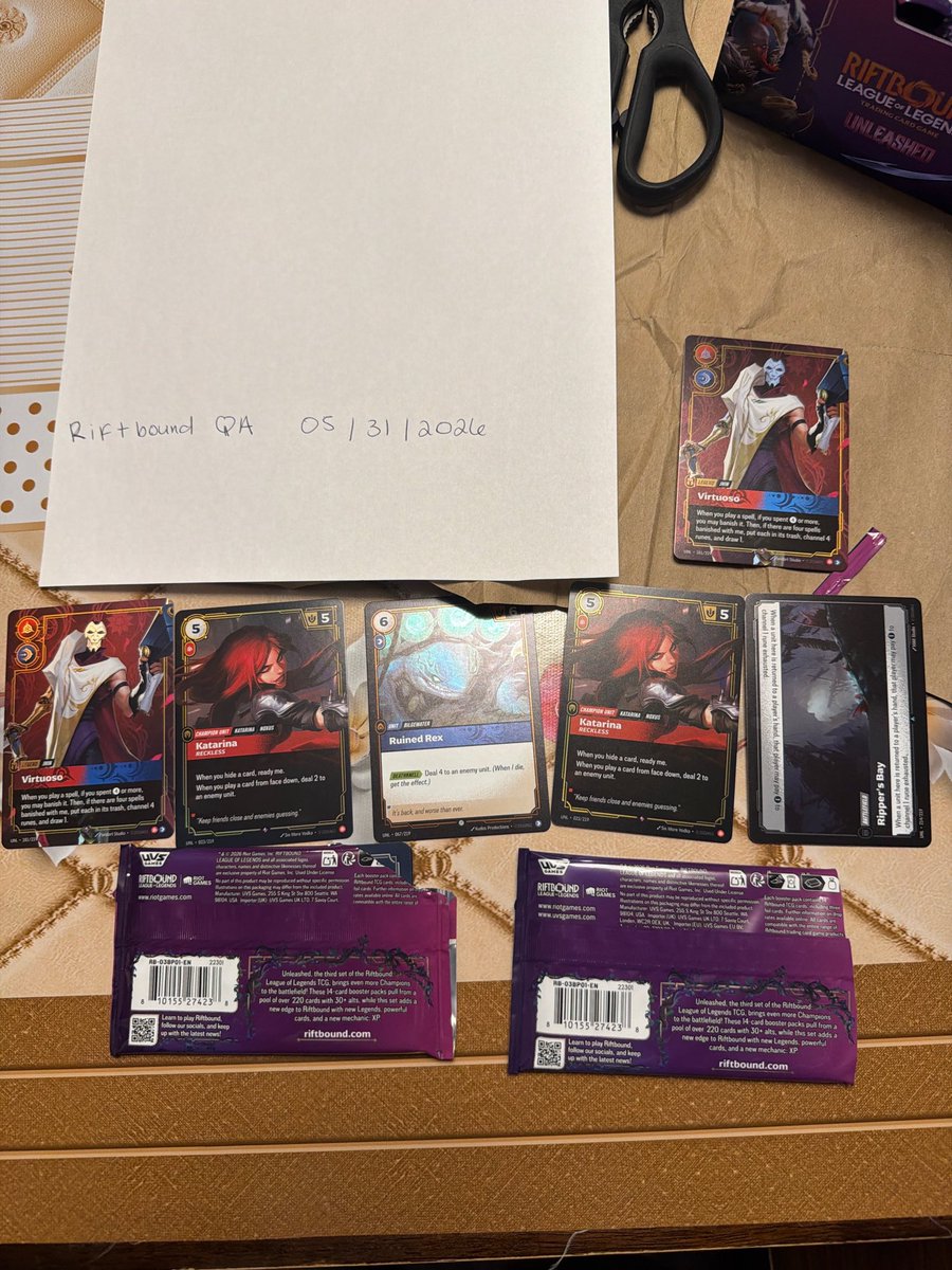 _nerdy9's tweet photo. @RiftboundReport @playriftbound @RiotSupport 2 booster boxes many packs out of separate boxes having the same two last cards, around 7 packs the same. Two packs pictured below. Now, how can this be helped? League players since 2016. https://t.co/agOHUHhBQM