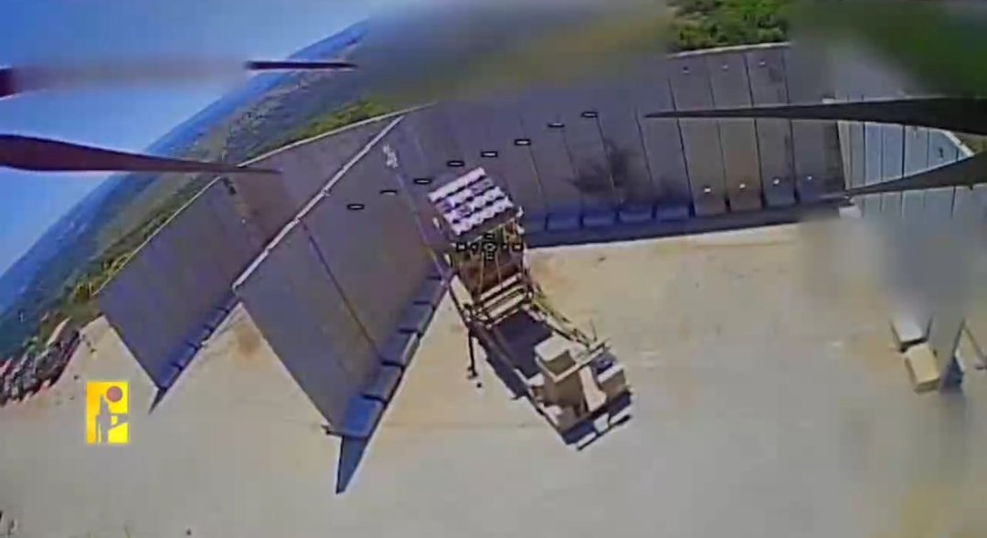 EGYOSINT's tweet photo. Hezbollah has released footage showing another Iron Dome air-defense launcher being struck by a fiber-optic-guided FPV drone.

The attack took place on May 26, marking the 7th confirmed Iron Dome launcher hit by Hezbollah FPV drones. https://t.co/a5qxMYFwb8