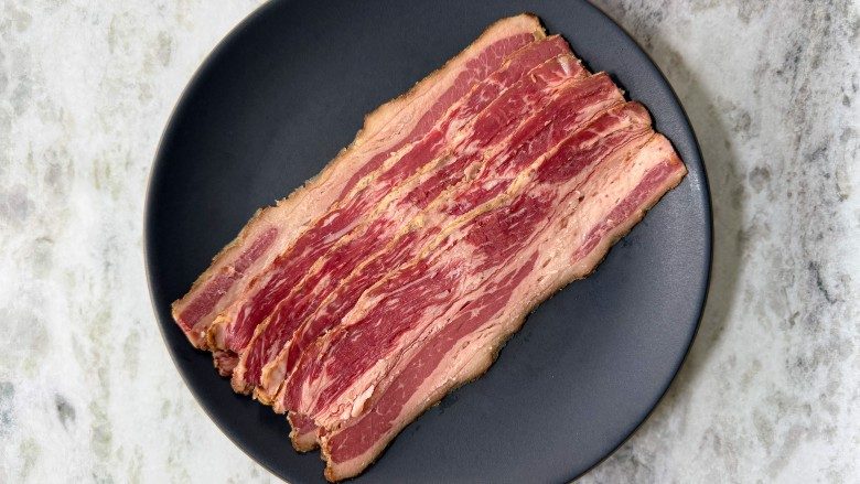 SamaHoole's tweet photo. "Red meat causes cancer. The WHO said so."

The scariest headline in food, and it is built almost entirely on people misreading a filing system.

In 2015 the WHO's cancer agency, the IARC, dropped processed meat into Group 1 and red meat into the weaker Group 2A. Group 1 also contains smoking, alcohol, and sunlight. Here is where everyone gleefully loses the plot. Those groups rank one thing only: how sure the scientists are that a thing does something at all, not how much harm it does. Sunshine and bacon sit in the same box. Oddly, nobody has launched a campaign against going outside.

So what is the actual risk? Fifty grams of processed meat a day, a couple of rashers, lifts your relative risk of bowel cancer by about 18 percent. Terrifying, until you do the sums. Lifetime odds of bowel cancer sit around 5 or 6 in 100, and the daily bacon habit nudges that from roughly 5 to roughly 6. A real effect, worth a shrug. Smoking, for scale, raises lung cancer risk by around 2,000 percent.

And here is the bit that should embarrass everyone involved. Even the processed meat link cannot really be pinned on the meat, because in these studies the keen bacon-eater is also, on average, the keen smoker, the keen drinker, the bloke who thinks a vegetable is a garnish and exercise is for other people. The studies are observational. They spot a pattern, call it a cause, and quietly file the steak-and-greens man next to the man whose "red meat" arrives in a bun at 2am with a pint.

You were sold a frightening number and charged nothing for the context. A fresh steak is a long way from a cigarette, and the filing cabinet was never evidence.

Eat the bacon.