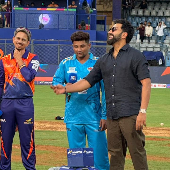 karhacter's tweet photo. Rohit Sharma, the brand ambassador of T20 Mumbai, tosses the coin for the second match of the tournament between Sarfaraz Khan-led Aakash Tigers MWS and defending champion MSC Maratha Royals, led by the stylish Siddhesh Lad https://t.co/ZJRZiWQ2yW