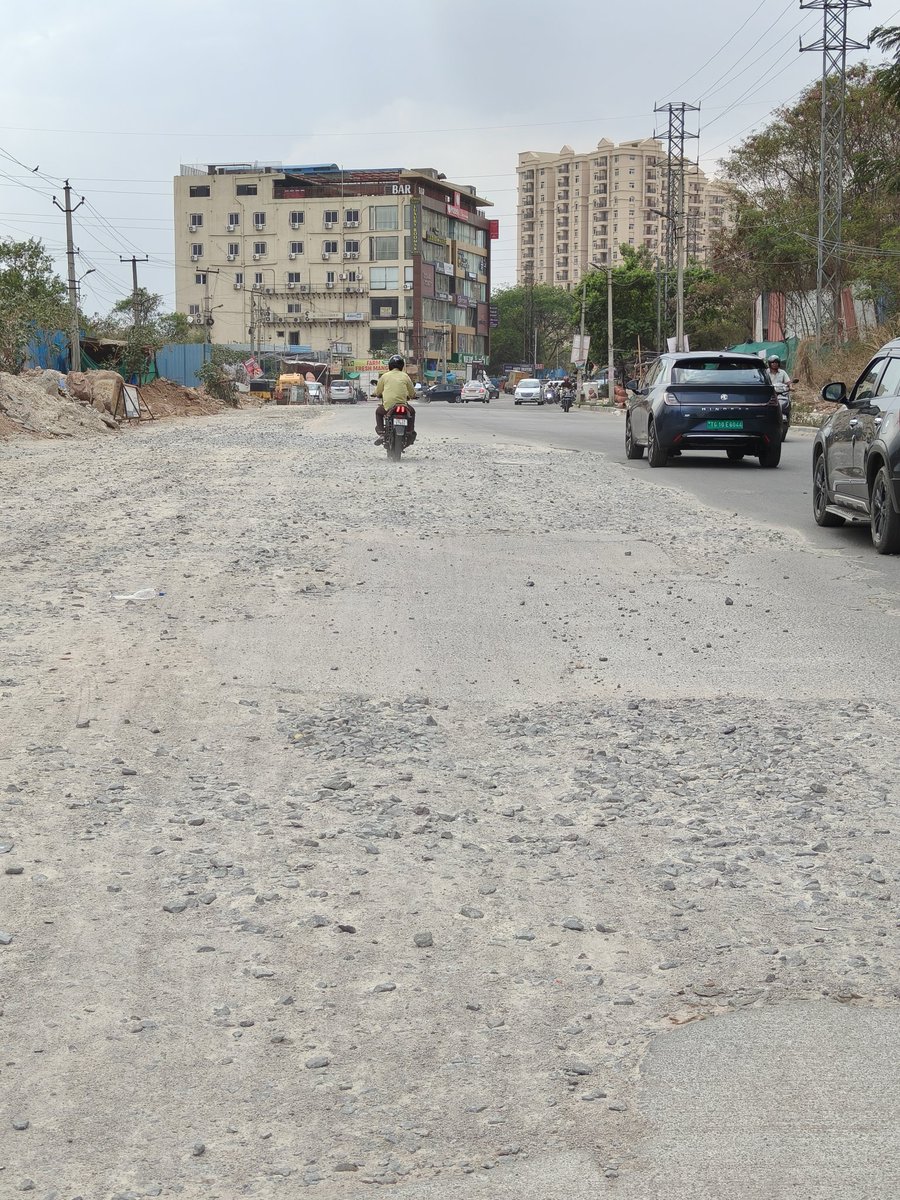 ash_chowder's tweet photo. @GHMCOnline It's a matter of shame that this is the state of the 'road' on the critical stretch 1 km away from HITEC City station, from KPHB Indu Fortune Fields Gardenia signal towards Hafeezpet since over a year @CMC_Offcl @MC_Cyberabad @ZC_Kukatpally1 @ZC_SLP. Please have this fixed ASAP. https://t.co/Qa2hrUqMOA