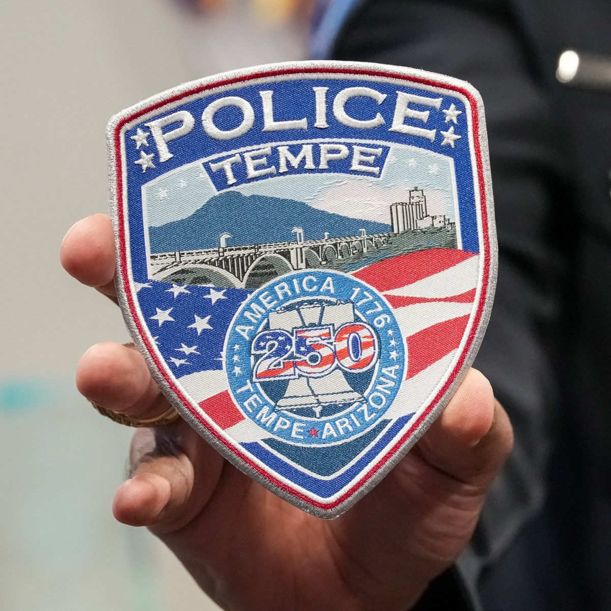 TempePolice's tweet photo. Starting today through September 30, 2026, Tempe Police officers will proudly wear our new America 250 commemorative patch. As Independence Day approaches, we are proud to wear a symbol that recognizes both our nation’s history and the values that guide our work. https://t.co/0Jvei5y7IK