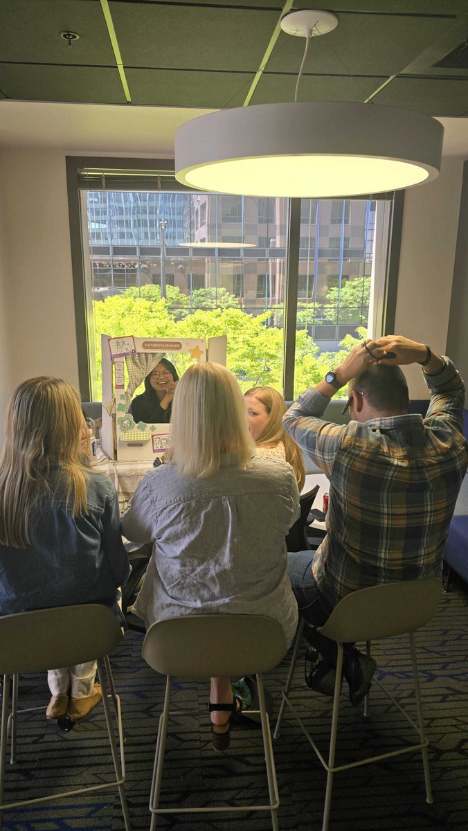Smartsheet's tweet photo. This AANHPI Month, our team showed up to celebrate and give back to the community. From a fireside chat with members of our executive team, to packing 50 hygiene kits for API Chaya to support survivors, and even a live drawing photo booth, it was a month filled with meaning. #SmartsheetLife