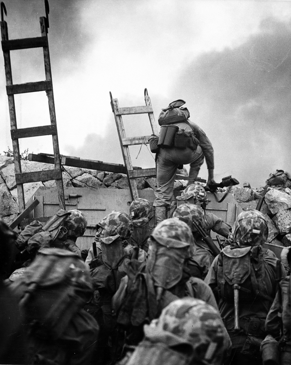 ForgottenWarPic's tweet photo. Lieutenant Baldomero Lopez of the Marine Corps is shown scaling a seawall after landing on Red Beach (15 September). Minutes after this photo was taken, Lopez was killed after covering a live grenade with his body. He was posthumously awarded the Medal of Honor.… https://t.co/B7muysD8wJ