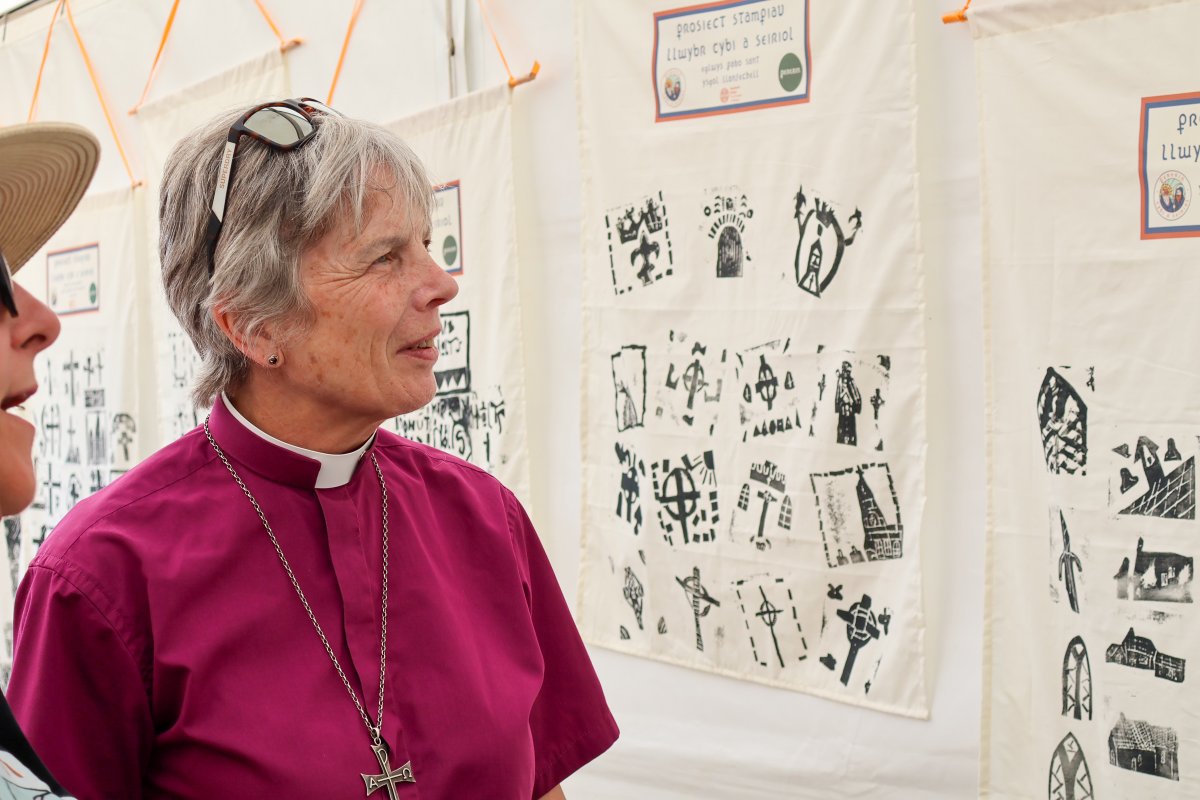 ChurchinWales's tweet photo. Here are some more photos from Archbishop Cherry exploring the stalls at this year’s Urdd Eisteddfod. Did you visit the Maes? Dyma ragor o luniau o’r Archesgob Cherry yn edrych ar y stondinau yn Eisteddfod yr Urdd eleni.  A wnaethoch chi ymweld â’r Maes?
#ChurchInWales https://t.co/2lv18FFiOB