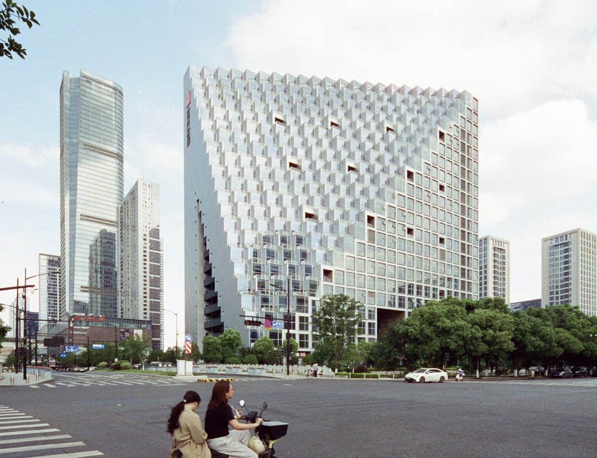Tender_Stream's tweet photo. The Hangzhou Prism, designed by Tenderstream member OMA , has been completed. Commissioned by Xinhu Real Estate Group for the Future Tech City district, the Prism is OMA’s first built project in Hangzhou.

Image Credits: OMA/Tu Ximeng/Zhu Wenqiao https://t.co/jxzAktSXlv