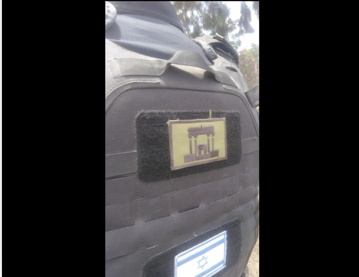 IhabHassane's tweet photo. An Israeli officer wearing a Third Temple patch on his backpack in the Christian village of Taybeh in the West Bank.  

How is this soldier supposed to protect Palestinians from settler terrorism when he shares the same ideology as settler terrorists?
https://t.co/QiOAbofNdn https://t.co/ePw7QJUcUK