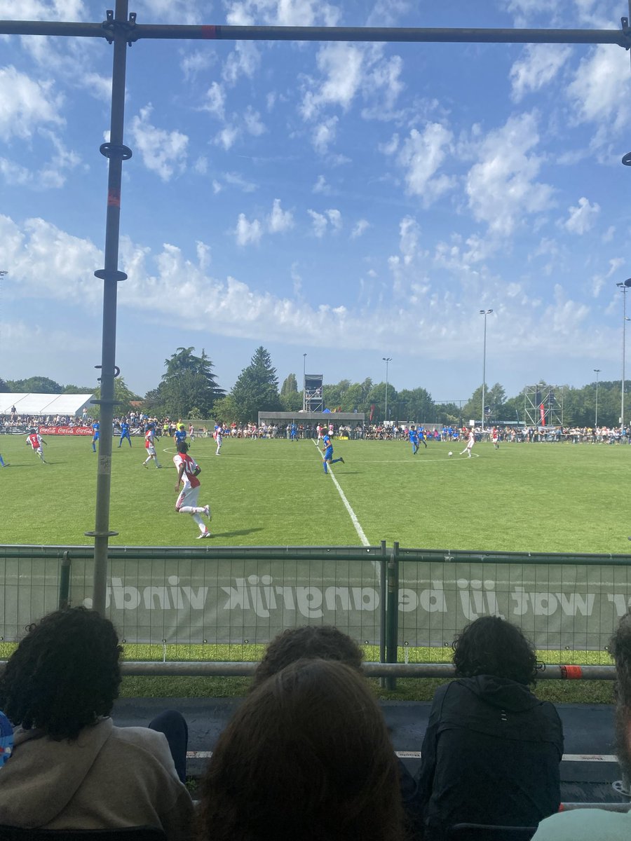 XxAdamKhanxX's tweet photo. Together with my team, I work across several professional football clubs in Europe and North America, with a primary focus on senior recruitment through U17 emerging talent pipelines from under-scouted and overlooked markets.

So why fly nearly 1,500 kilometres to watch more than a dozen matches featuring some of the most talented U-15 players in European football?

It’s certainly not for the Belgian stadium food. I’m still not entirely convinced whether I ate a burger or a sponge between two slices of bread.

The reality is that this tournament sits well outside my typical working environment. The majority of my work involves evaluating senior players and identifying talent in markets that are often overlooked by the wider industry. Spending a weekend around elite U-15 football is therefore not about finding players for immediate recruitment purposes.

Instead, it’s about understanding the level that sits 12-24 months ahead of the age groups and profiles I most commonly work with.

Observing how the game’s most promising young talents are being developed, what attributes are being prioritised, and how the elite development landscape is evolving provides valuable context for my own work. It helps me better calibrate expectations for players in my recruitment markets, understand how far along their development cycle they should realistically be, and identify trends that will inevitably influence the player pool two years later.

Live scouting at youth level is about far more than identifying individual talent. It is an opportunity to understand development pathways, track evolving market dynamics, and gain insight into the trends that will shape the game’s next generation. The better we understand where elite football is heading, the better equipped we are to make informed decisions today—regardless of where we operate within the recruitment pipeline.