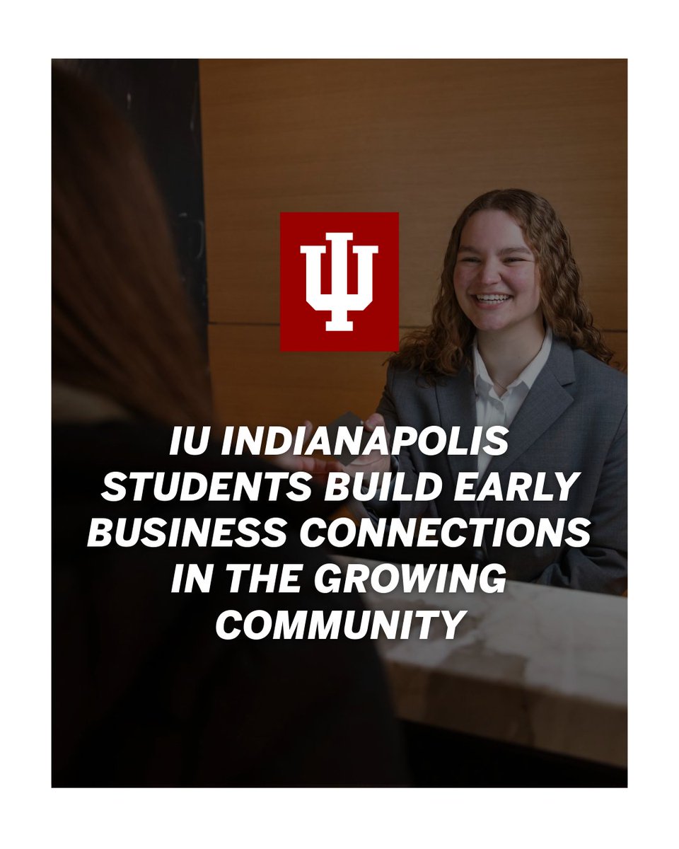 A person with long hair is smiling while sitting at a table in a professional setting, wearing a business suit. A prominent Indiana University logo is centered above the text: "IU Indianapolis students build early business connections in the growing community.