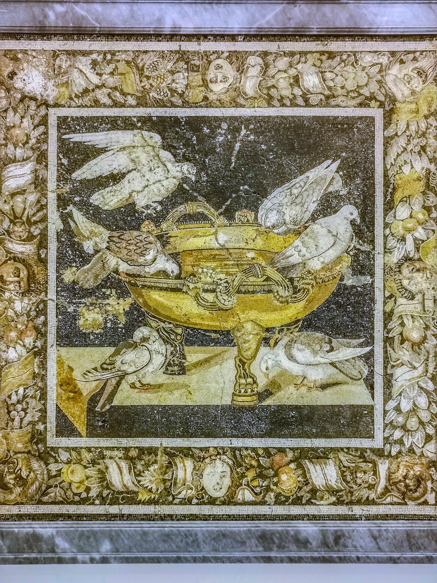 antmoose's tweet photo. For #MosaicMonday, a version of Pliny's Doves from 200 years before the more famous example in the #CapitolineMuseums, this one from #Pompeii and now in #Naples. This one has a splendid garlanded #frame with theatrical #masks, and two extra doves. Superlative. https://t.co/GncCMnRO7I