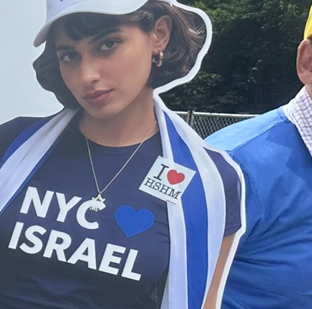 rafaelshimunov's tweet photo. “I ❤️ HSHM” is the Jewish name for God. It’s affixed here on a cutout of Mayor Mamdani’s wife, Rama. They are Muslim. 

So not only are Israel parade goers mocking their boycott of the nation genociding fellow Muslims, they’re converting them. And on Eid. 

Imagine the outrage if Muslim activists did this with cutouts of Jews or Christians.
