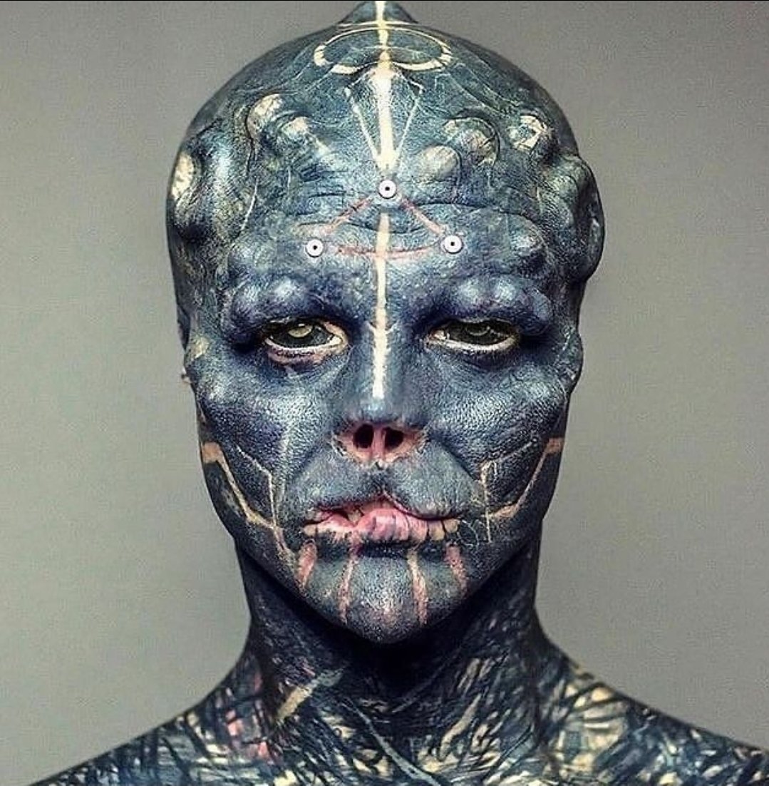 Pls_find_tanya's tweet photo. Hey @grok touch up this photo to remove all the tattoos and all the cosmetic surgery's he has https://t.co/49aQ6XB0Bw