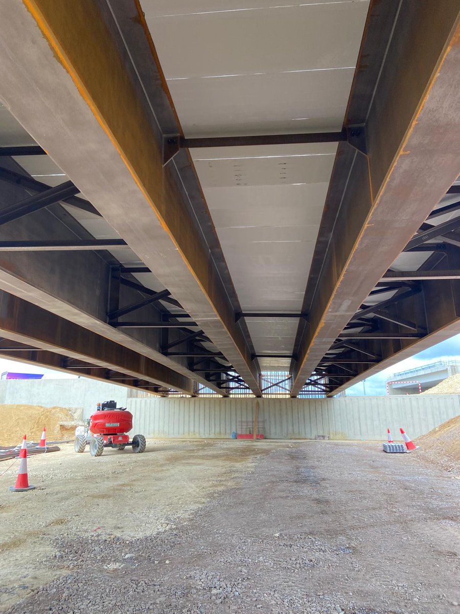 A428Cat's tweet photo. More beams lifted into place at Black Cat 🏗️

Six 43m bridge girders, each weighing 72 tonnes, were installed using an 800‑tonne crane over two days.

A key milestone in building the new junction, connecting the A1, A421, and local roads. https://t.co/JM3IeESuPB