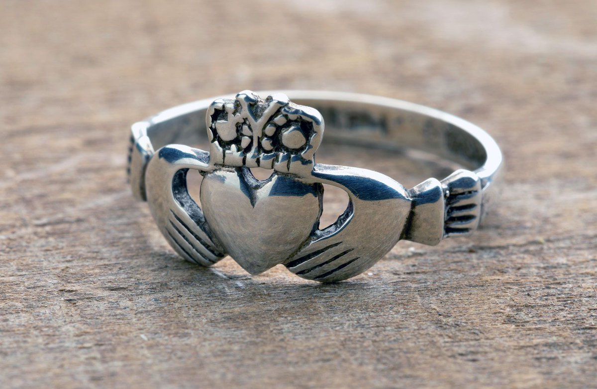 RobLooseCannon's tweet photo. The legend of the iconic ring originates in the riverside cottages huddled beside the Corrib near the walls of Galway cty. Claddagh was an ancient Irish speaking fishing village with its own laws and customs, it even elected a local “King”. 

The villagers of Claddagh lived off the salmon runs, mending nets and hauling currachs. But they also had another specialist trade. They were goldsmiths.

Around 1675 Richard Joyce, a member of one of the Tribes of Galway, left Ireland for the West Indies, seeking his fortune. Instead, he was captured by Algerian pirates and sold into slavery in North Africa. There, by chance or fate, he was purchased by a Moorish goldsmith.

For fourteen years Joyce learned the craft. The folklore says it was then he fashioned the design of a ring bearing two hands clasping a heart, surmounted by a crown, a token of fidelity for the woman he had left behind on the shores of Galway Bay. Whether this was the first Claddagh ring or a refinement of an existing motif is still debated. As is pretty much every bit of the tall tale.

In 1689, following diplomatic negotiations under King William III, Joyce was freed. His master had been so impressed by his skill, he offered him half his wealth and his daughter’s hand in marriage. Joyce refused and returned home. According to tradition, his sweetheart had waited. He placed the ring on her finger, and they were married. So that definetely happened, or not. 

What is not legend is that some of the earliest surviving Claddagh rings, dating from around 1700, bear the maker’s mark “RI”, widely accepted as Richard Joyce’s initials. The design was inspired by the Italian "mani in fede" hands clasped in faith. What distinguished the Claddagh version was the crown, a symbol of loyalty reflecting allegiance to the King of the Claddagh. 

By the mid-1700s, goldsmithing began to shift into the city proper.Local tradition held that any fisherman found in Galway Bay without the ring could be punished as he wasnt part of the guild, entitled to fish the waters. 

In 1750, Thomas Dillon established what would become the most famous Claddagh ring workshop. The Dillon family moved production from the margins of the city to William Street and later Quay Street, closer to trade, visitors, and the growing tourist economy. While other makers followed, the Dillons became custodians of the tradition, and today they are the only jewellers permitted to stamp their rings with the word “ORIGINAL”.

The 19th century carried the Claddagh ring far beyond the Corrib. Queen Victoria’s visit to Ireland in 1849 brought royal attention to the design. The Famine Queen, along with Queen Alexandra and King Edward VII, wore Claddagh rings supplied by the Dillon workshop, transforming a regional custom into a fashionable symbol. 

And it was during that Great Hunger , with families from the Claddagh emigrating to Britain, America and beyond that the ring spread, becoming treasured heirlooms passed from mothers to daughters.

The heart obviously stands for love, the hands represent friendship and the crown is supposed to signify loyalty. But its the way the ring is worn that communicates your personal life. 

Worn on the right hand, heart facing out, means single and up for it. Right hand, heart facing in means youre in a relationship. When its on the left hand, heart facing out, youre engaged. On the left hand, heart facing in, youre married.

Buy the Dublin Time Machine a pint and support the DTM Book
https://t.co/U7jtCrOTtb