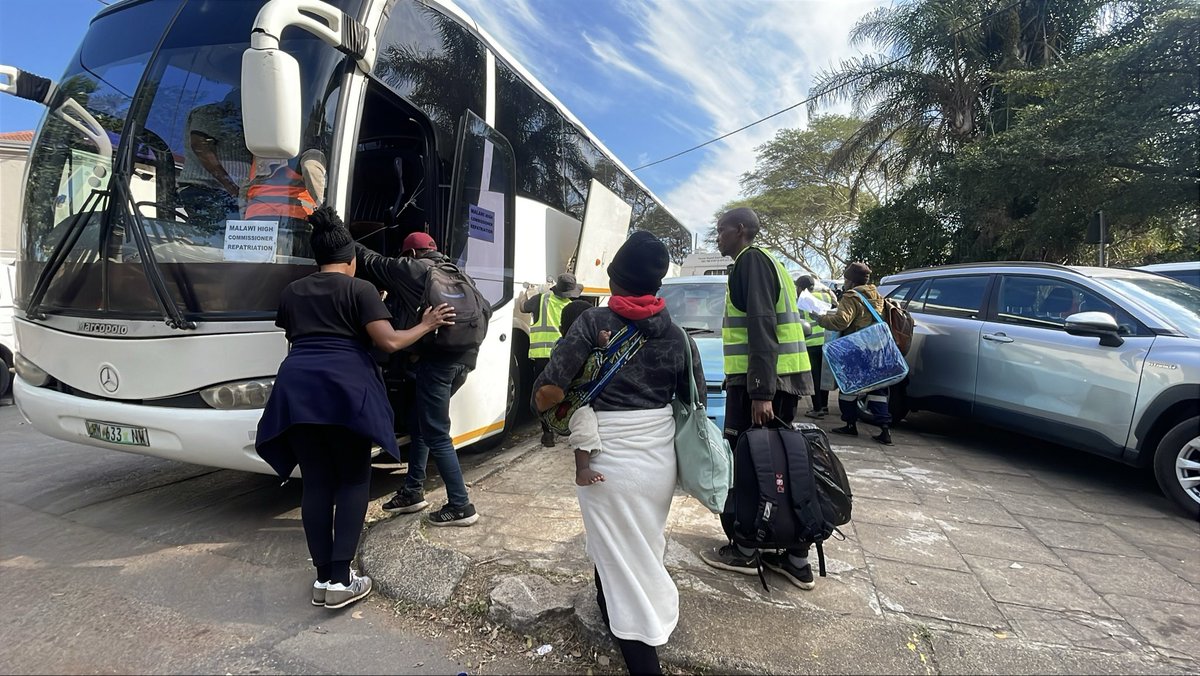 Logic_Malinga's tweet photo. More buses are expected at the Sherwood Hall repatriation site in Durban today as Malawian nationals continue preparing for the long journey home. One bus is currently loading passengers after eight buses left yesterday. #sabcnews https://t.co/Lc6syDuMLc