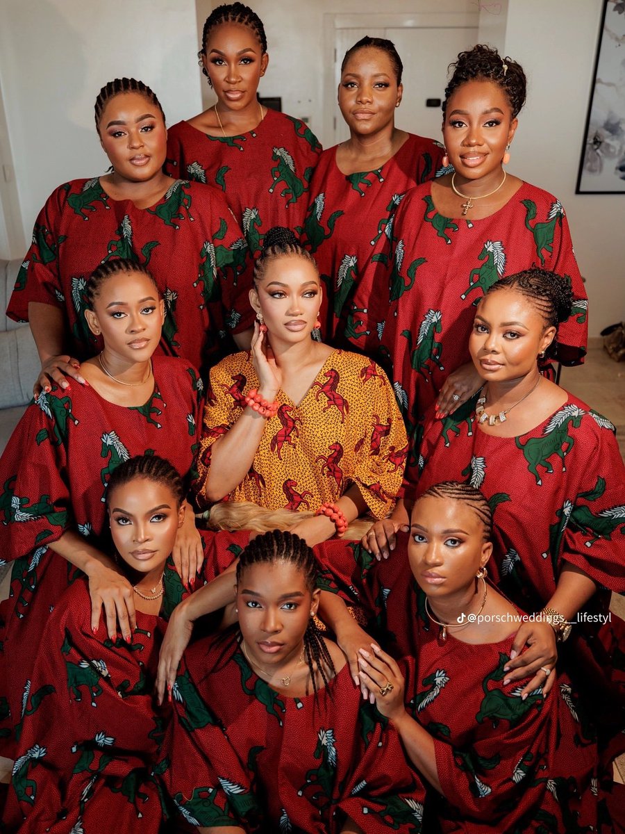 Starqueensly's tweet photo. Coordinated bridesmaids(umuagbo nkpu), the bridal handfan(Akupe), and dancing in the crowd accompanied by bridesmaids for spectators are aboriginal pre-colonial Igbo customs.

This tradition is recorded in Basden’s 1920 record discussing the ancient Nkpu ceremony, a ceremony which marked a young woman’s transition into marriage known as Igbankwu today. 

BRIDAL TRAIN (Umuagbo nkpu): The bride walked through the town with a close group of friends and peers, written about as “maids of honour” and known natively as Umuagbo Nkpu(The Nkpu Maidens). 

The entire group was uniformly(also) “smeared red with camwood dye from the crown of the head to the feet” to match the bride perfectly.

The Origin of the Akupe (Bridal Fan): The decorative bridal handfan started as a practical, necessary tool. The text notes that the bridesmaids carried “large fans wherewith to refresh their ladies after the bouts of dancing.” Their job was to keep the bride cool and comfortable during her long public procession.

The origin of Money Spraying in Igbankwu (Igbo wedding): 

Gifting money to a dancing bride is a centuries old tradition. The record shows that the bride would dance with high energy to celebrate with the community. In response, onlookers dropped cowries (the currency of that era) into a basket or calabash at her feet to show their approval and offer financial support.

While modern traditional weddings (Ịgba Nkwu) use new fabrics and updated words today, the foundational structure: the supportive sisterhood, the symbolic handfan, and the community coming together to gift money comes straight from early Igbo heritage.
