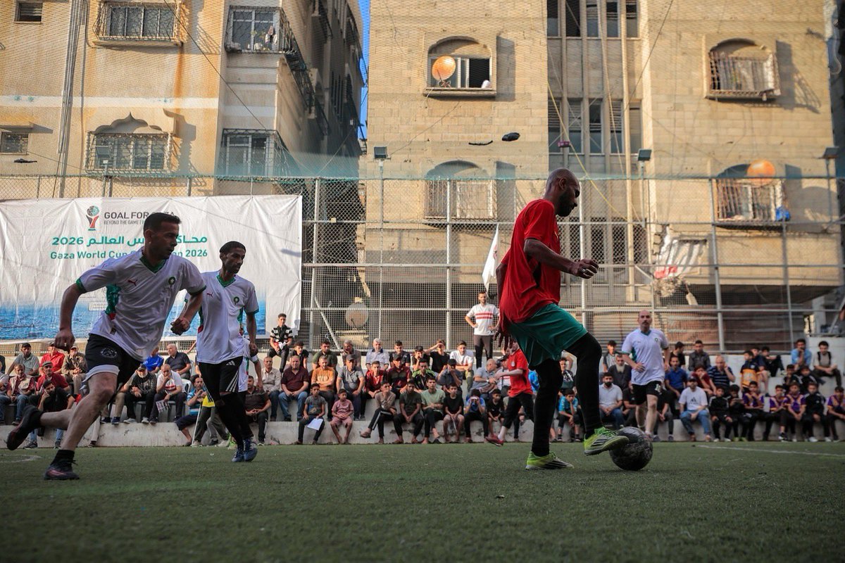 Sport4Palestine's tweet photo. The Goals for Gaza match, hosted in the Holst Stadium, saw footballers &amp; fans in the Gaza Strip celebrate football  and thank clubs &amp; fans across the world who have stood with Gaza. 

The match embodied Gazans’ determination to live. #goalsforgaza #stopthegame https://t.co/bKjoWt8q1N