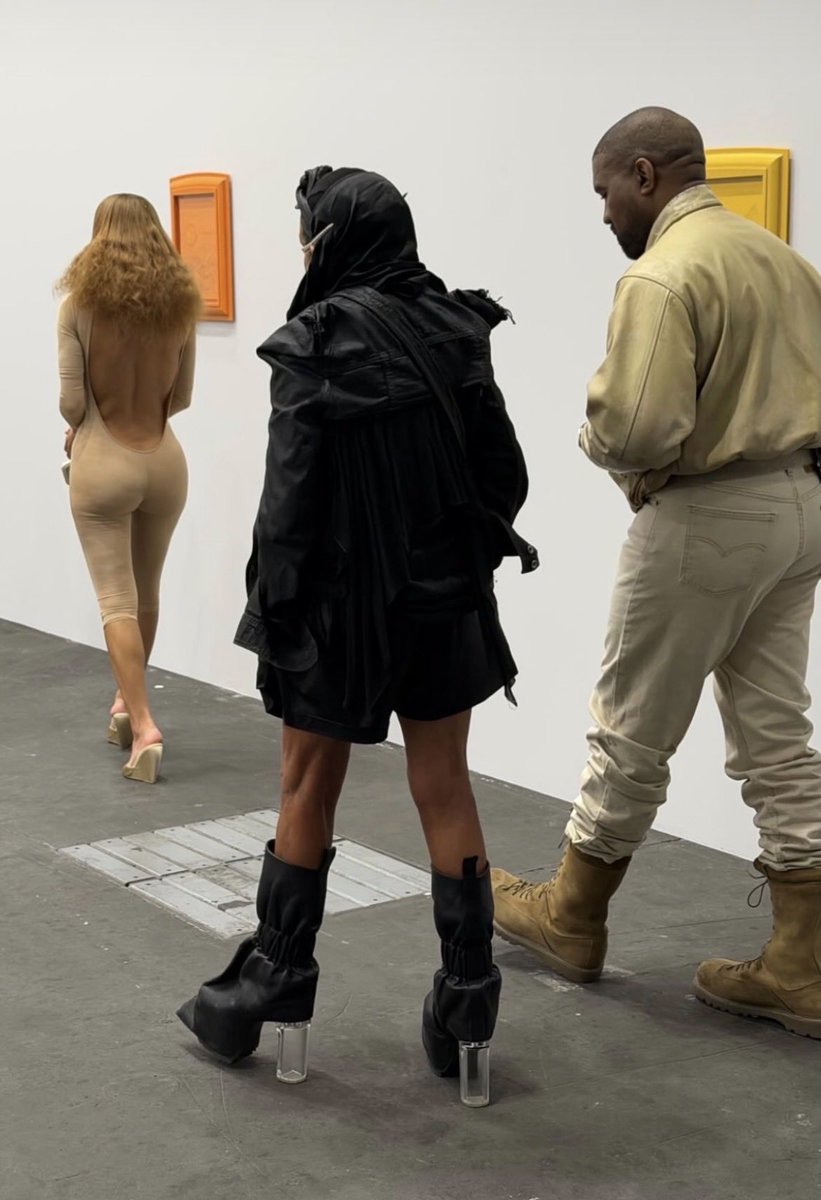 Yeeezyrih's tweet photo. Bianca Censori, Michele Lamy, and Ye at Art Basel Switzerland today https://t.co/mMuC32Pt2U