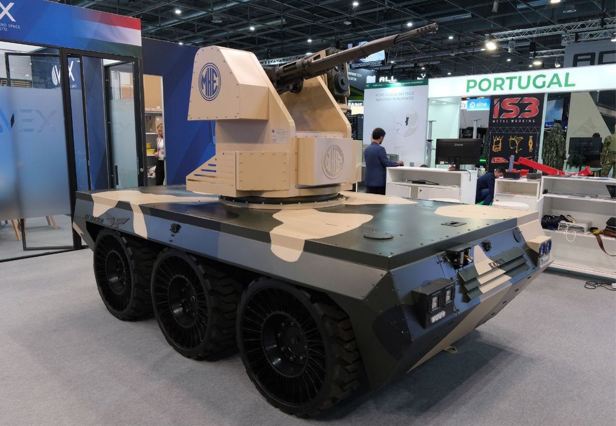 Drone_Wars_'s tweet photo. Hungarian company HT Division has reportedly showcased its 6x6 Katica unmanned ground vehicle at Eurosatory 2026. The UGV was displayed with a short-range air-defense configuration integrating a 20 mm weapon system from Turkish company TOLGA. #Hungary #Katica #UGV #AirDefense https://t.co/8IDEKibLXX