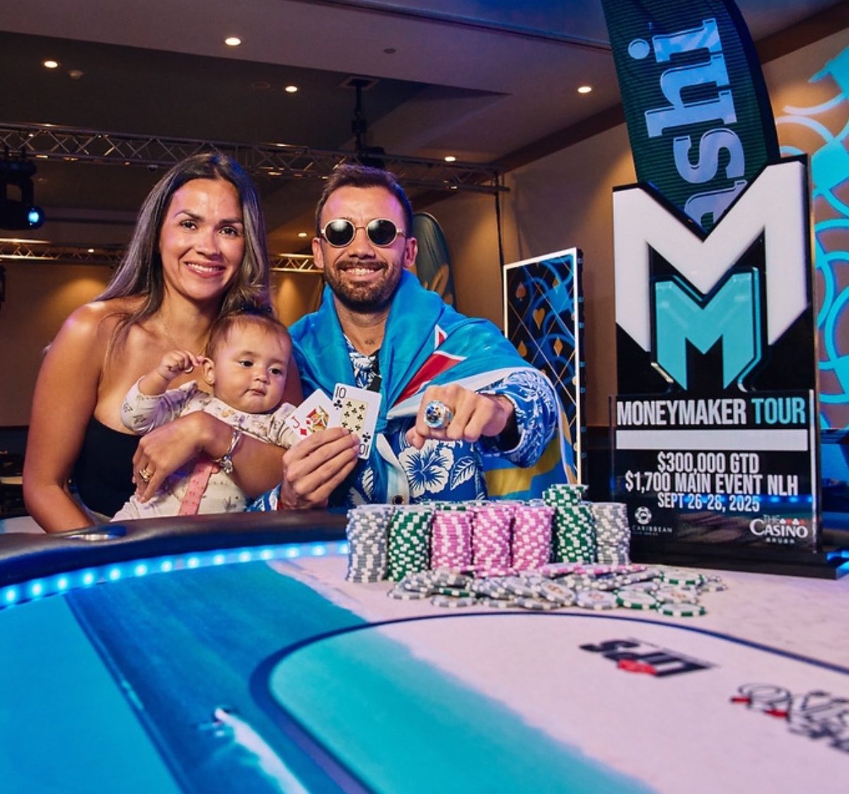MoneymakerTour's tweet photo. You could be next. 🏆

Last year’s Aruba Main Event champion celebrated with his family by his side. Now it’s your turn.

🌴 Hotel booking and the full 2026 Aruba schedule are live at https://t.co/ZHSHa3xbKl

#MoneymakerTour #CaribbeanPokerSeries #Aruba https://t.co/SdIckLPvDC