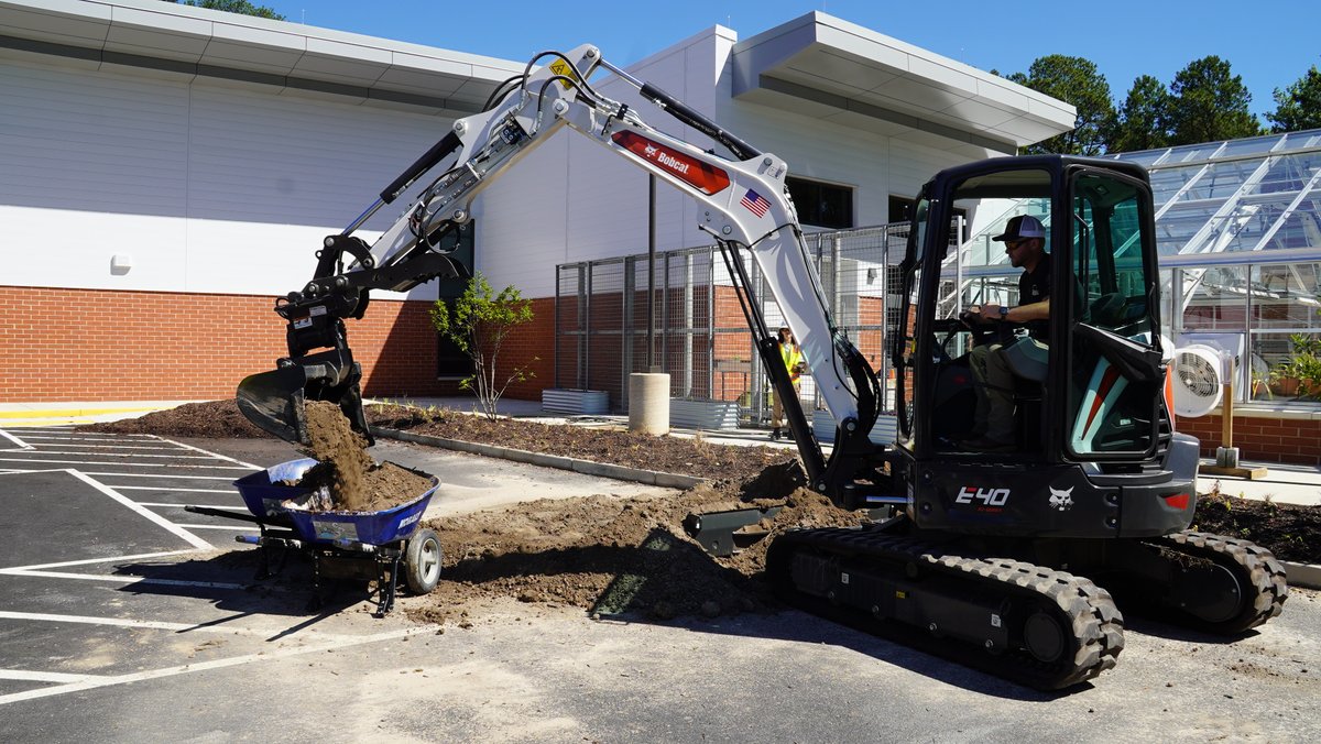 HenricoCTE's tweet photo. The Summer Career Camps Heavy Equipment students got to work with a small excavator while they helped the landscaping program students prepare a bed to plant trees and bushes in the school parking lot. #HenricoCTE #LifeReady #Henrico https://t.co/KKPIETGI6a