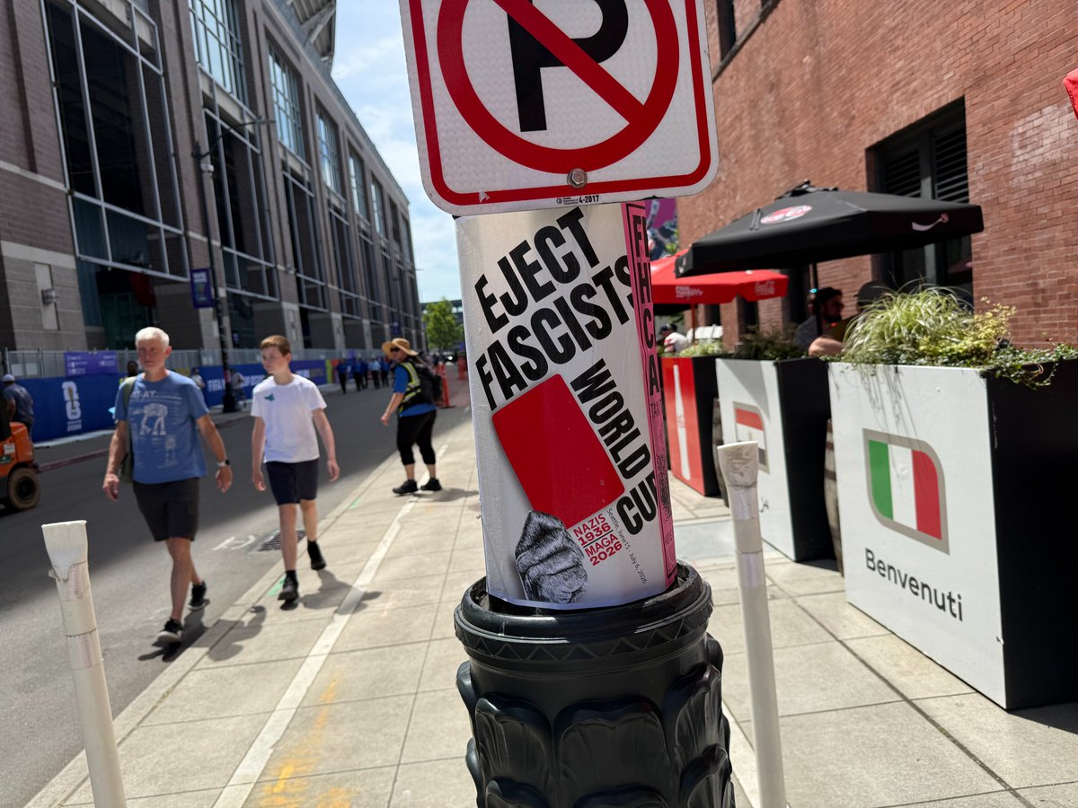 Seattle36ers's tweet photo. BEFORE AND AFTER. Love the "modification" someone made (not us).  These posters were all around outside Seattle stadium so expect to see protesters for the duration. https://t.co/jCtvOXCmFb
